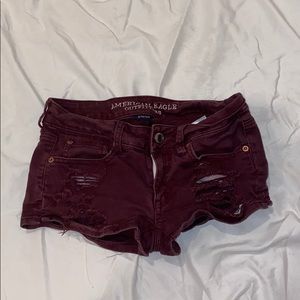 Maroon ripped jean shorts from American Eagle
